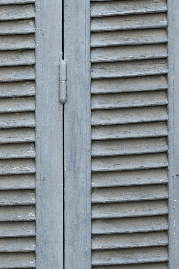 Photo 15284: Worn, narrow, grey folding shutters