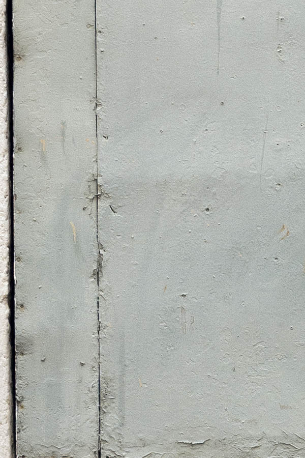 Photo 15336: Worn, formed, grey double door covered with plates