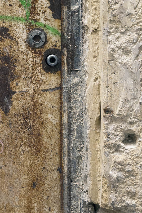 Photo 15370: Decayed, unpainted plate door with latticed fan light