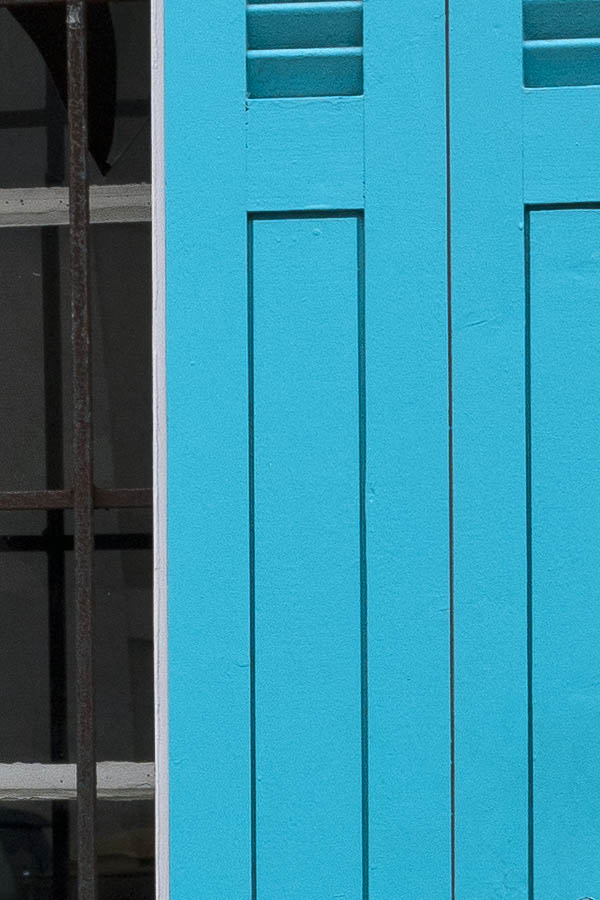 Photo 15434: White, barred window with two frames, six panes and turquoise folding shutters