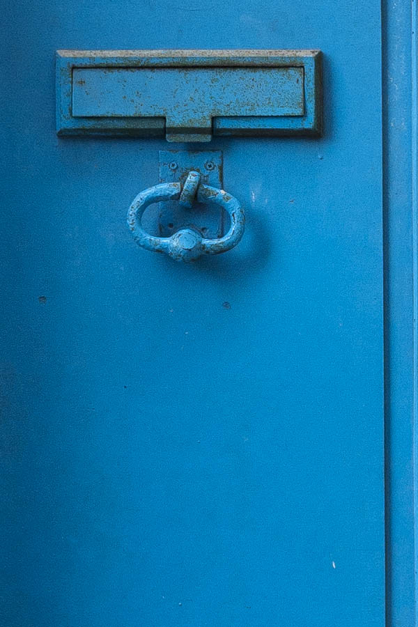 Photo 15456: Lopsided, panelled, light blue door with lopsided top window