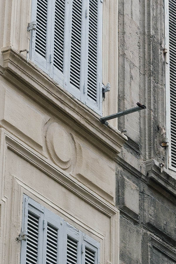 Photo 15521: Facade with 28 pairs of narrow, grey folding shutters