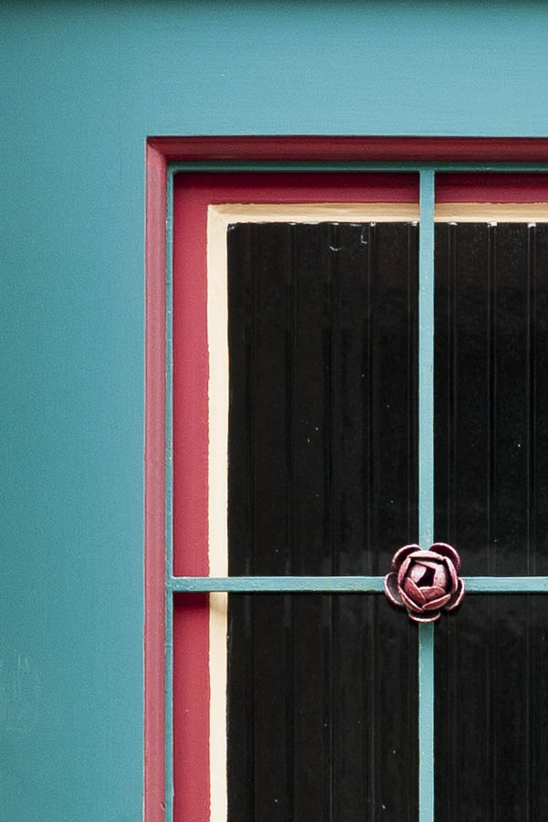 Photo 15682: Panelled, teal, red and white door with top window and latticed door light
