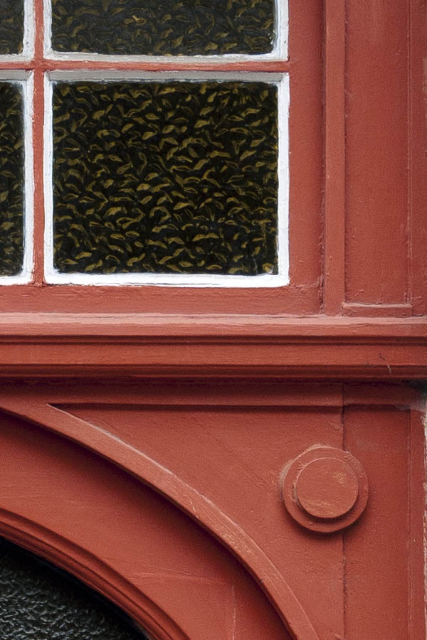 Photo 15698: Formed, panelled, red door with top window and formed, latticed door light