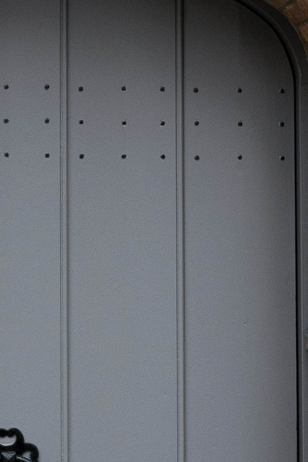 Photo 15915: Formed, grey door made of planks with top window