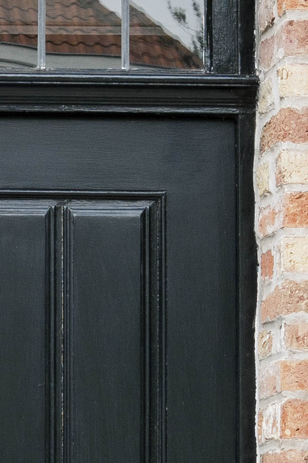 Photo 16074: Panelled, black door with top window