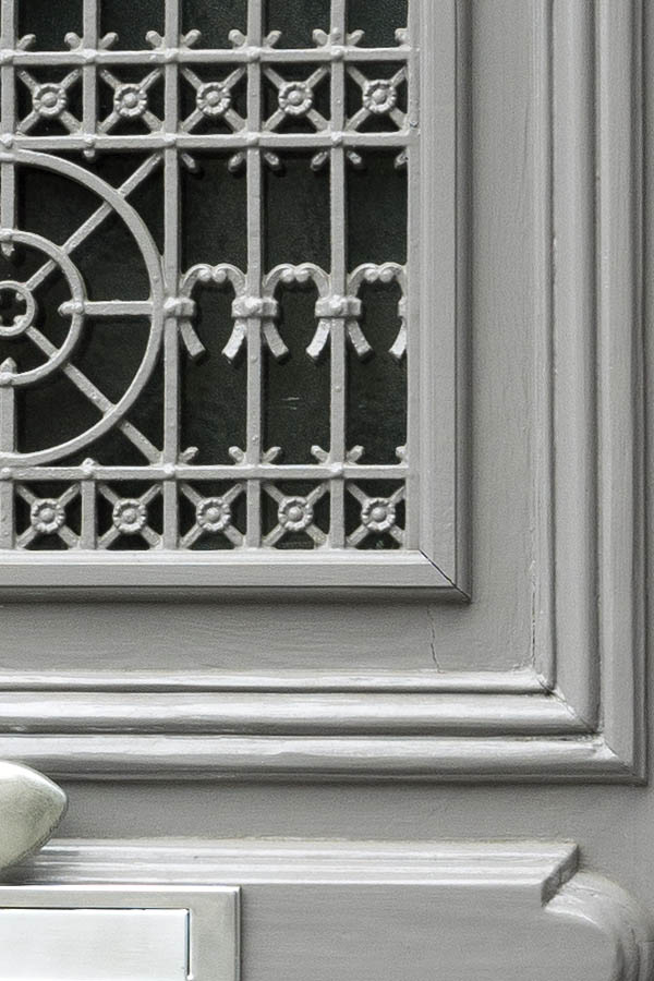 Photo 16099: Panelled, carved, grey door with top window and door light