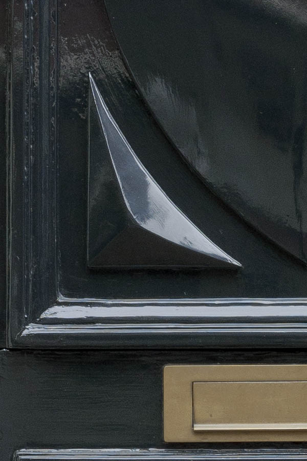 Photo 16162: Carved, panelled, dark blue and white door