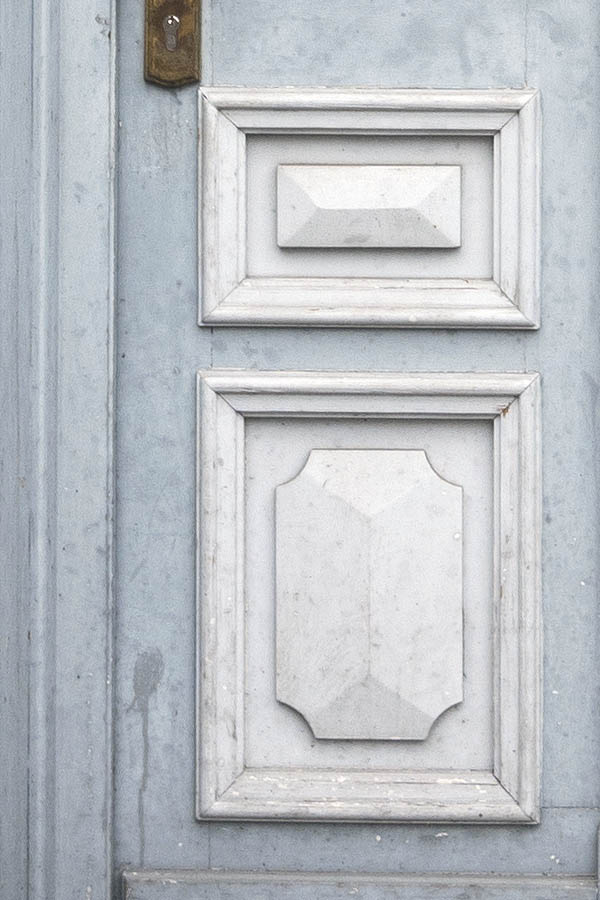Photo 16182: Worn, wide, lopsided, panelled, light grey and white door with top window