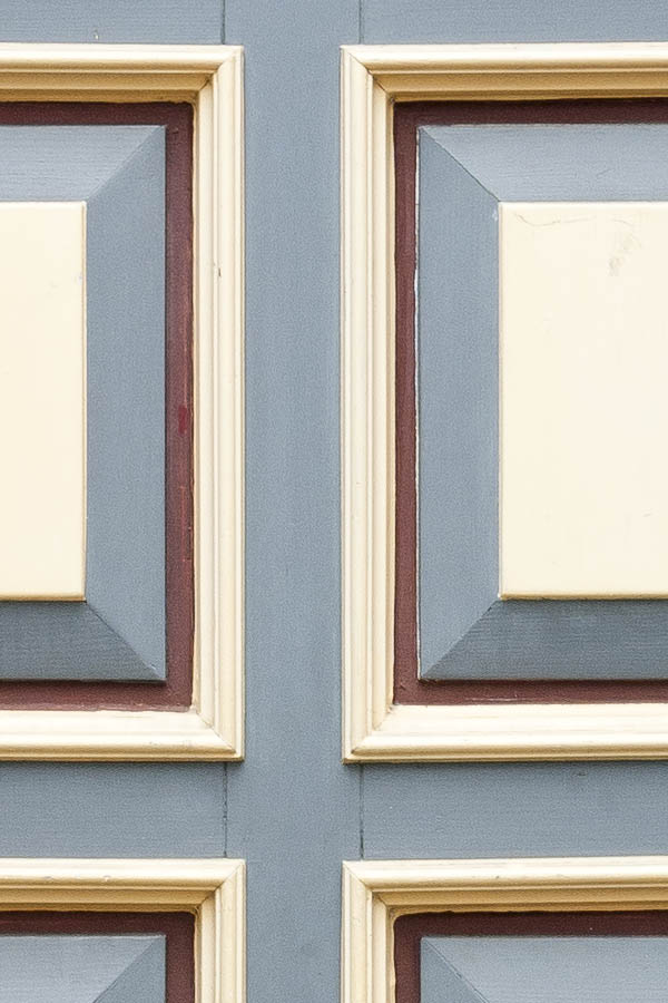 Photo 16324: Panelled, carved, grey, light yellow and red door