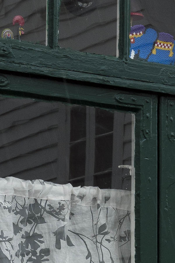 Photo 16605: Green T-post window with three frames and seven panes