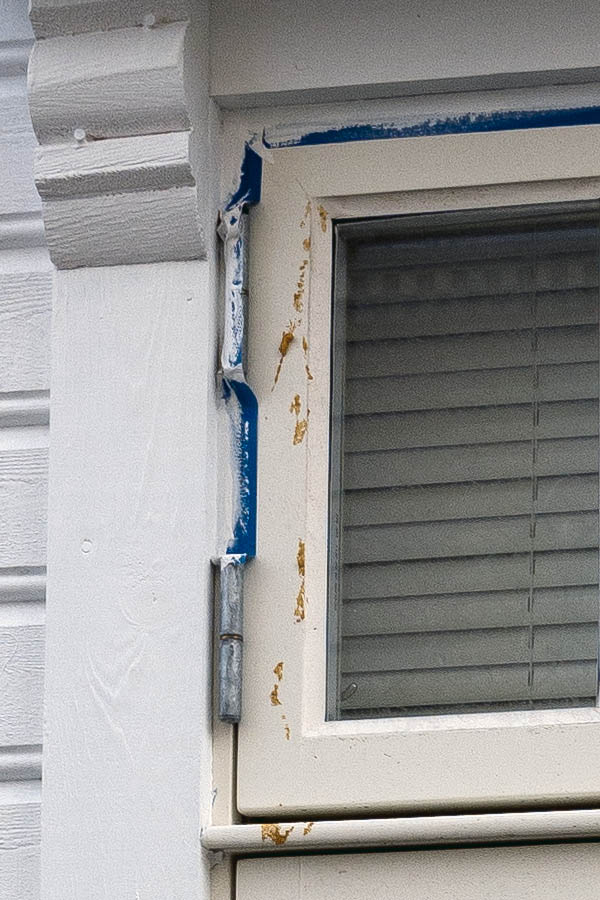 Photo 16693: Narrow, light yellow window with four frames.