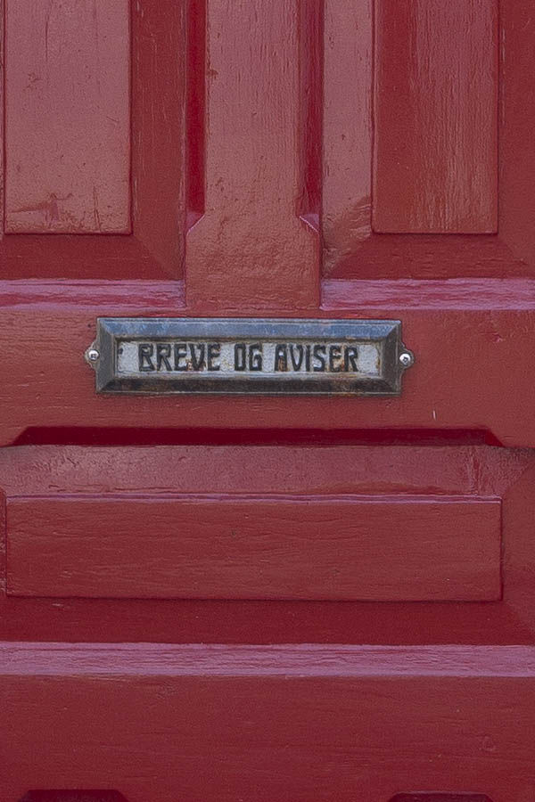 Photo 16871: Panelled, carved, red door with sidepieces and white top window