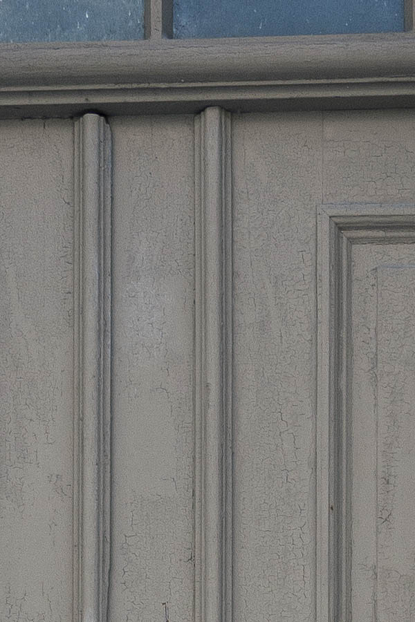 Photo 16997: Worn, panelled, grey double door with top window