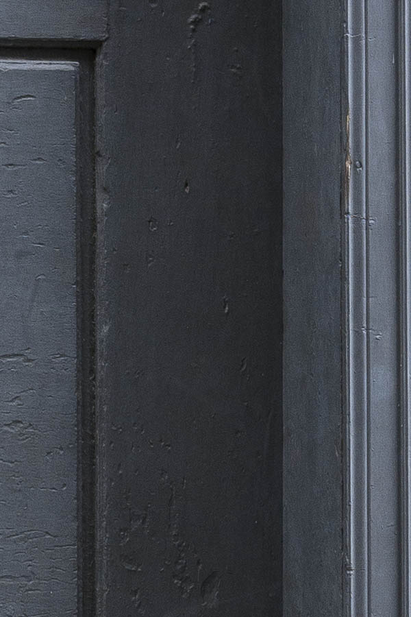 Photo 17347: Worn, panelled, grey door with door light