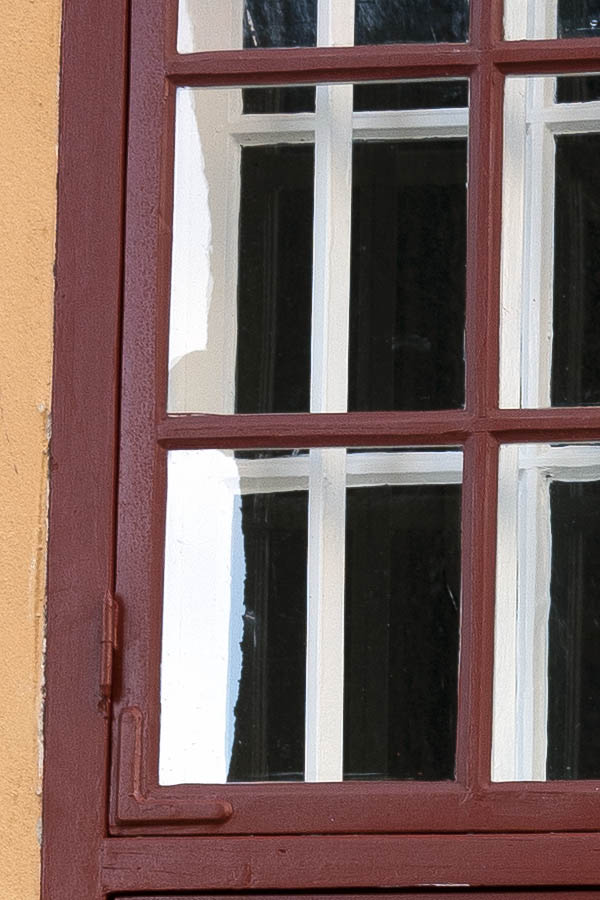Photo 17613: Large, barred, brown window with four frames and 24 panes