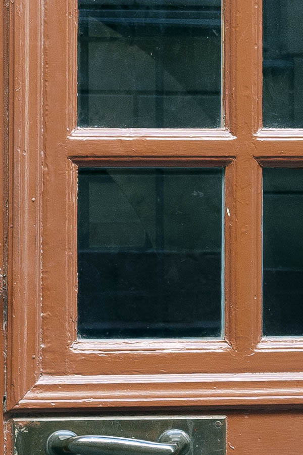 Photo 17784: Panelled, carved brown door with doorlight and sidepieces