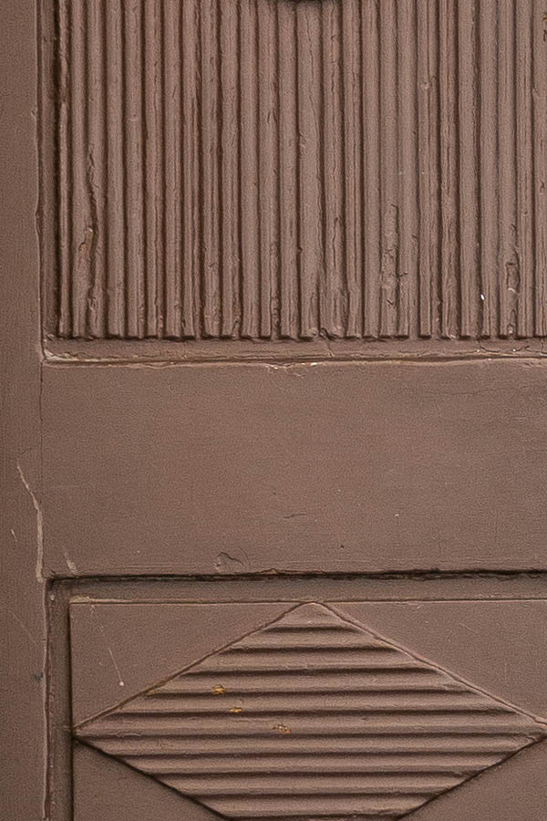 Photo 17877: Lopsided, worn, panelled, brown, carved double door