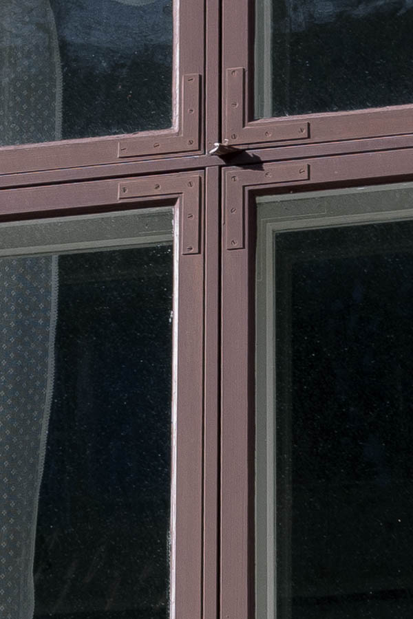 Photo 17981: Red window with four frames and a white, carved outer frame