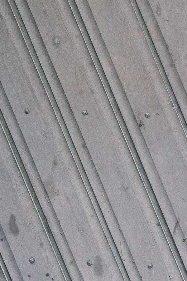 Photo 18220: Brown door of diagonal boards in a teal frame
