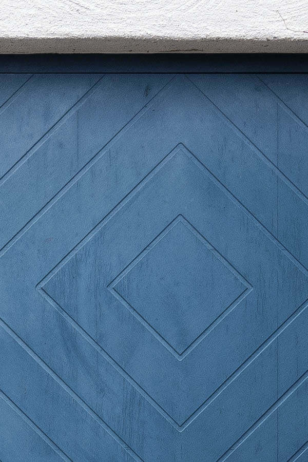 Photo 18352: Blue garage door with diagonal pattern