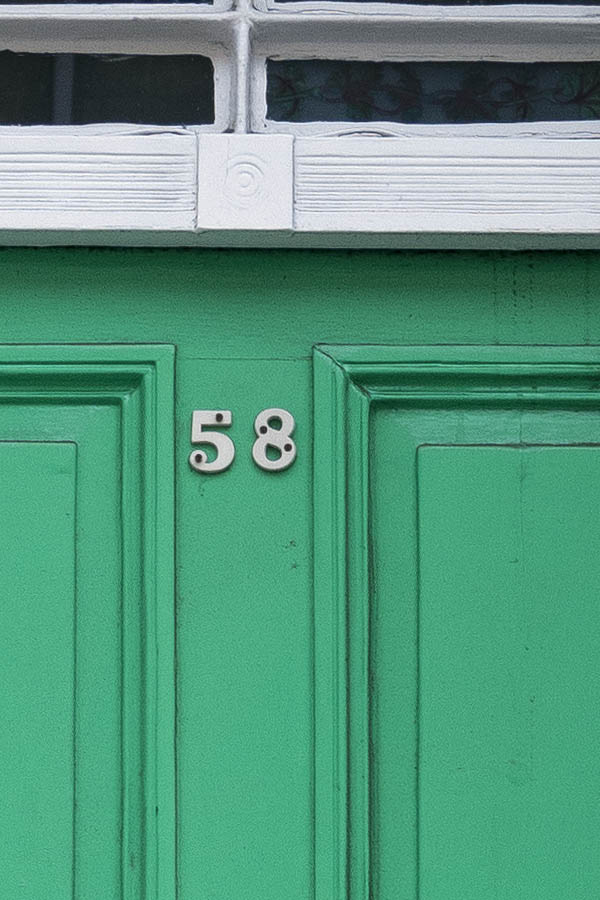 Photo 18757: Panelled, green door with top window in a white frame