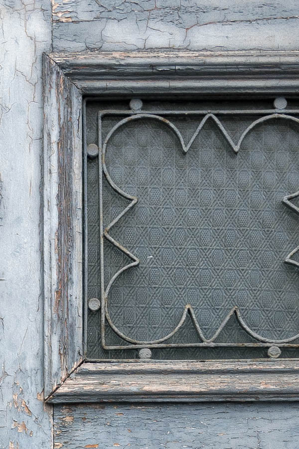 Photo 19494: Worn, latticed, teal double door with top window