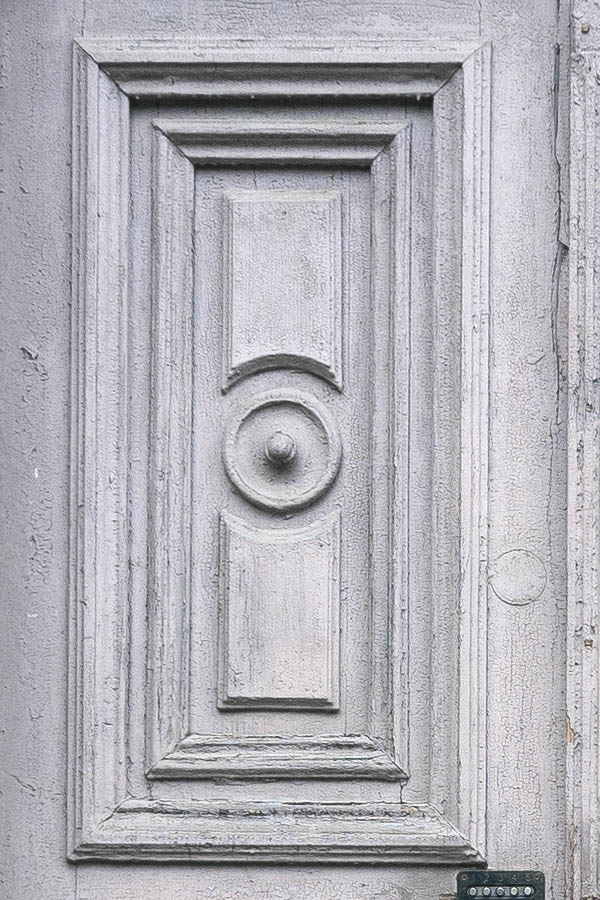 Photo 19714: Worn, panelled, carved, grey double door with top window