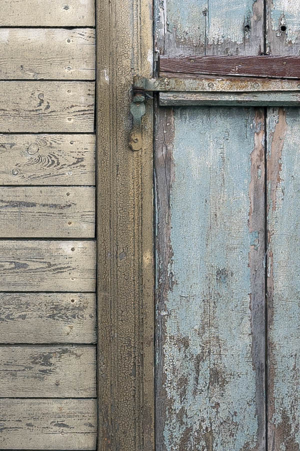 Photo 19767: Two green, shuttered windows in a light brown board partition