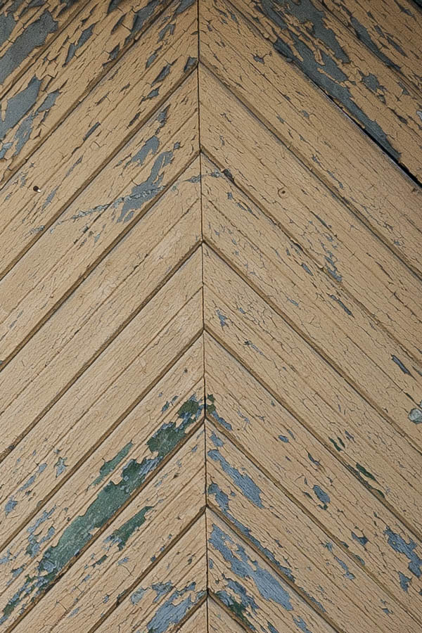 Photo 19858: Decayed, formed, light brown gate of diagonally mounted boards