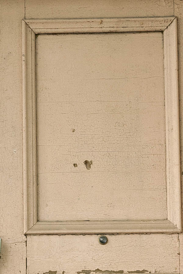 Photo 19988: Worn, light yellow double door with top window