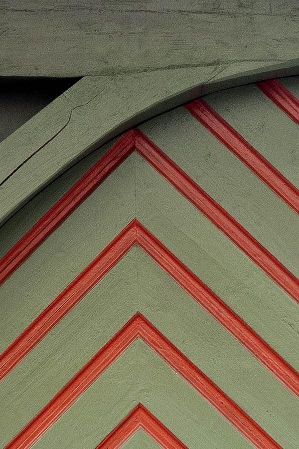 Photo 20032: Formed, red and green gate of diagonal boards with minor door