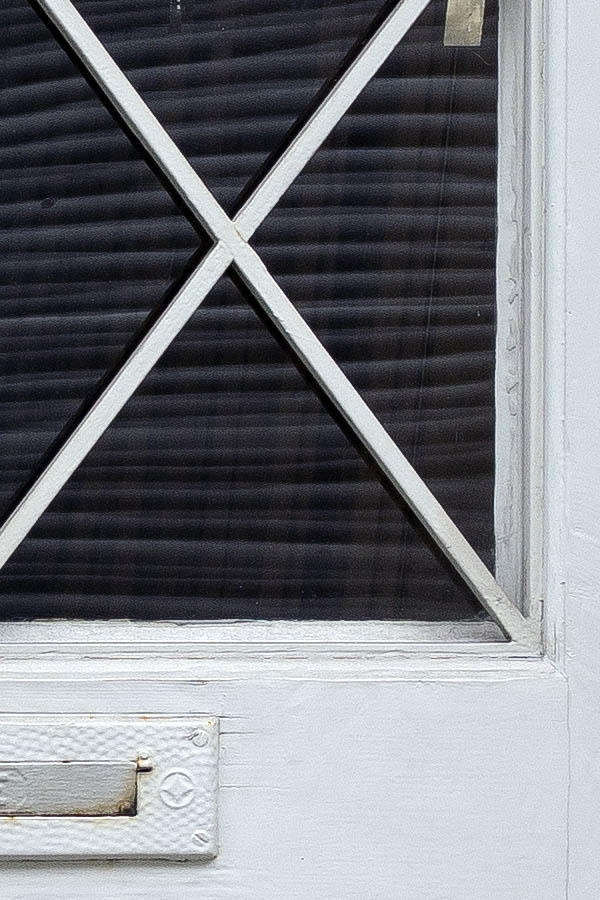 Photo 23832: Panelled, light grey door with latticed door light and top window