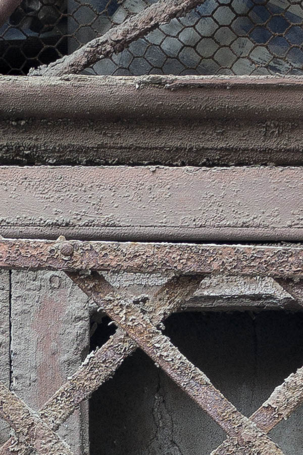 Photo 23944: Decayed, formed, barred, latticed, brown, unpainted, rusty window
