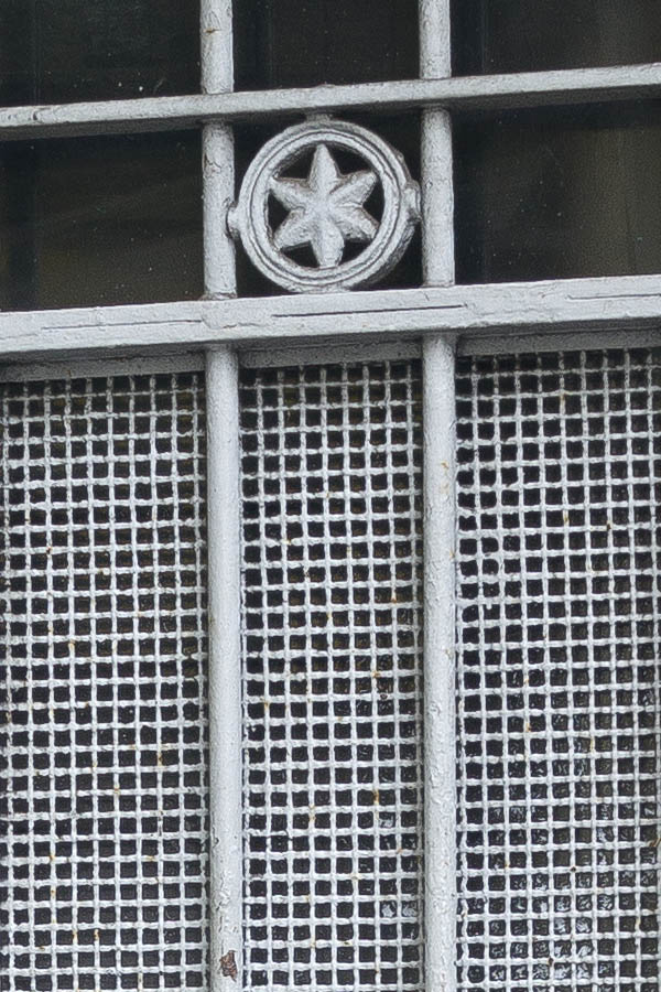 Photo 23947: Formed, grey metal door with lattice