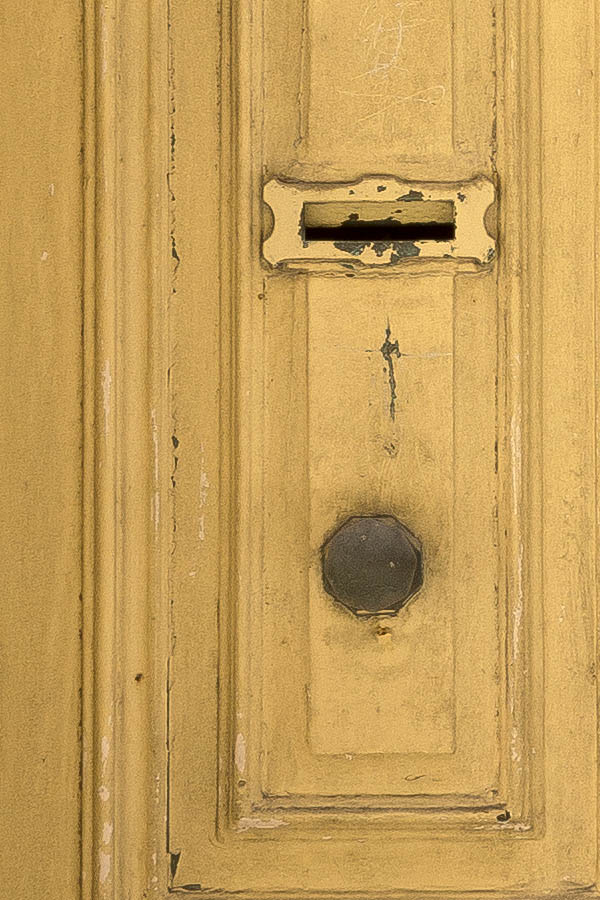 Photo 24110: Worn, panelled, yellow double door with latticed top window