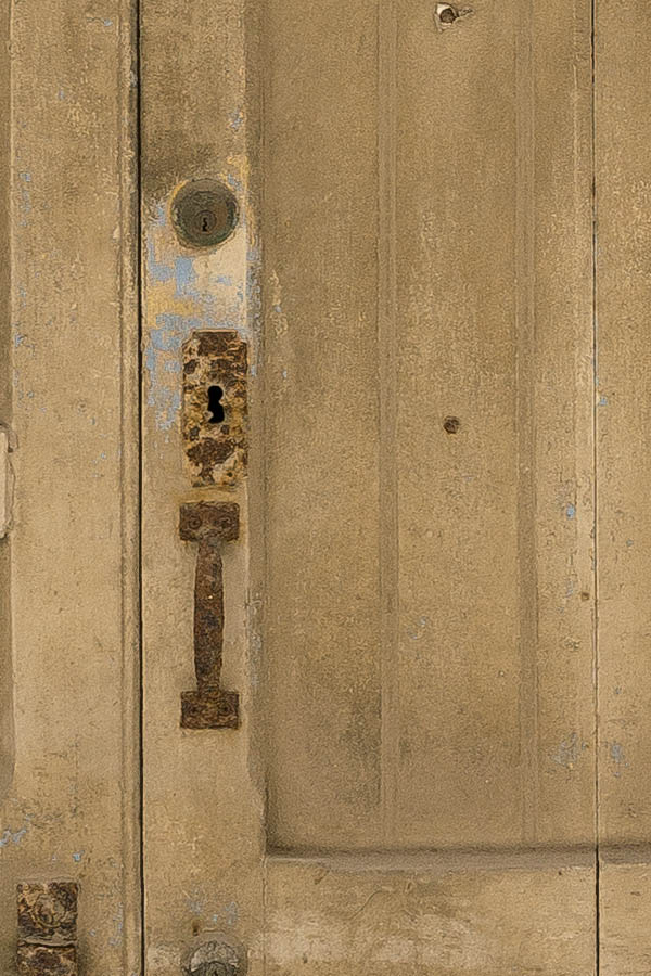 Photo 24114: Worn, panelled, yellow garage door with latticed fan light