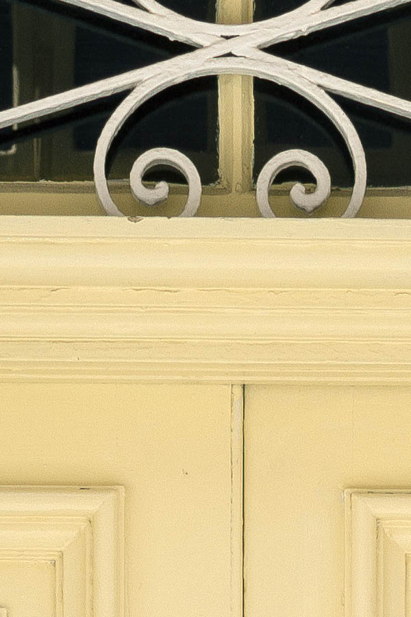 Photo 24174: Panelled, yellow double door with latticed top window