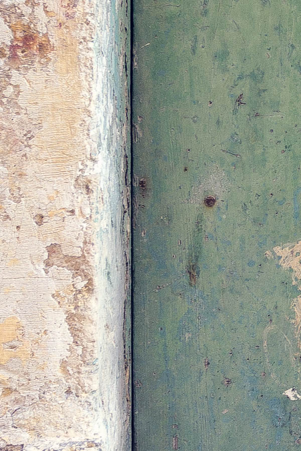 Photo 24198: Decayed, narrow, green double door made of planks with a barred top window