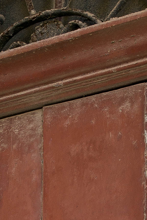 Photo 24280: Worn, brown gate made of planks with a latticed fan light