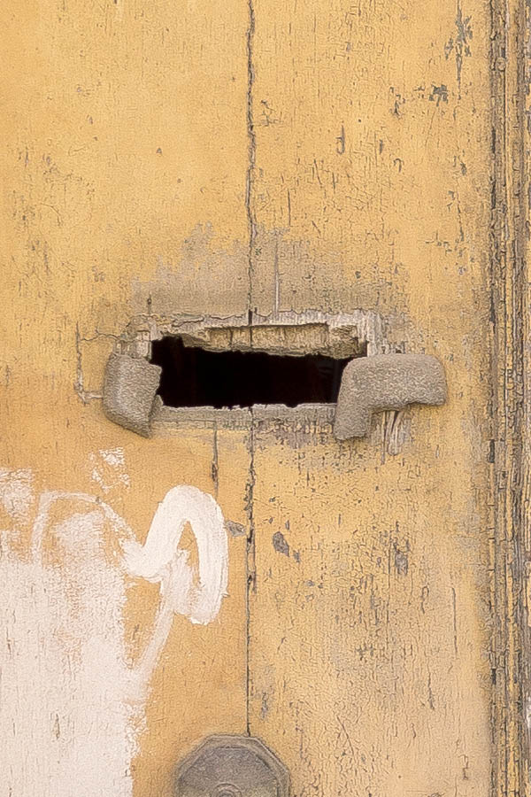 Photo 24289: Decayed, panelled, yellow and unpainted double door with latticed fan light.