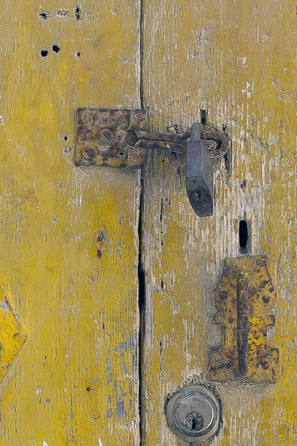 Photo 24318: Worn, yellow double door made of planks.