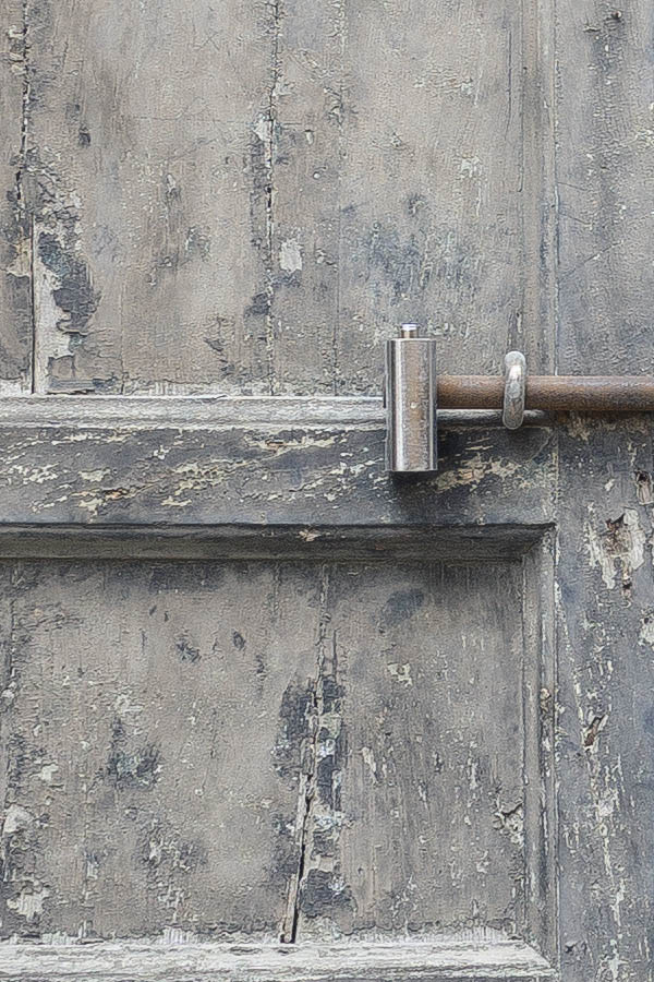 Photo 24479: Worn, panelled, grey double door with latticed fan light