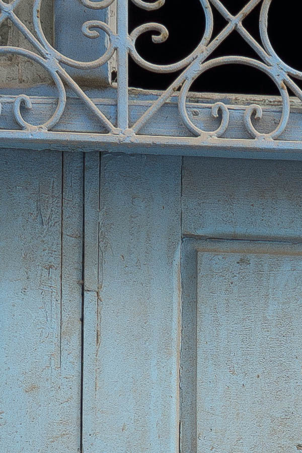Photo 24583: Worn, panelled, carved, light blue gate with latticed top window