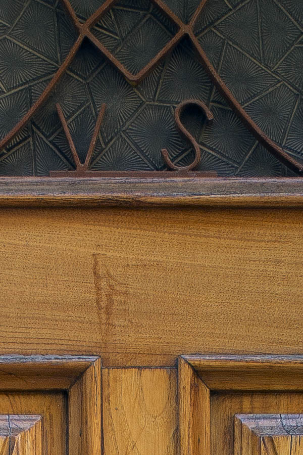 Photo 24674: Panelled, carved, lacquered door with latticed door light