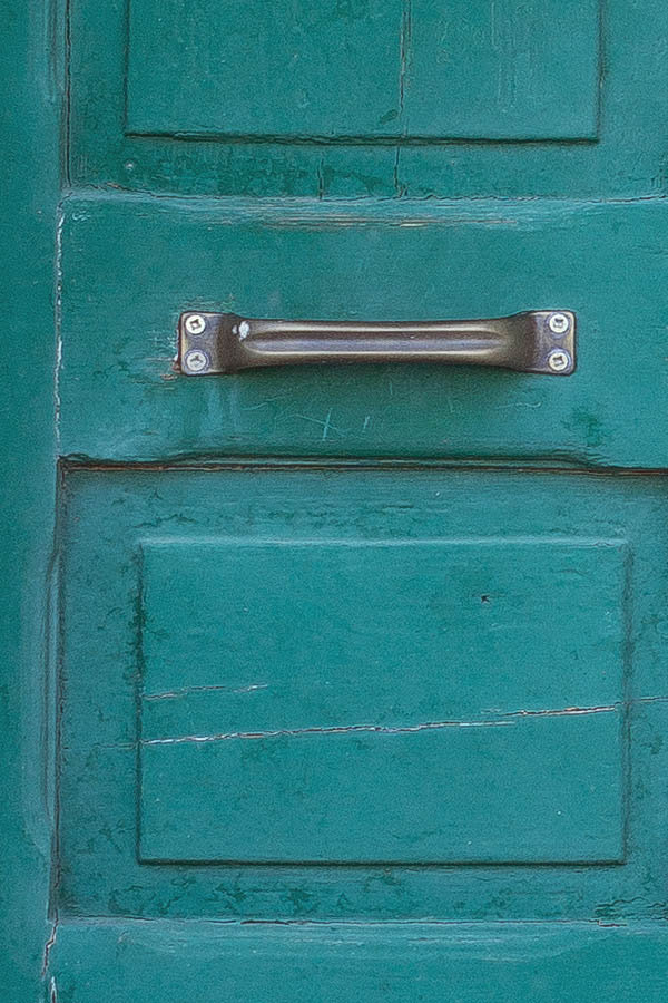 Photo 24711: Worn, carved, panelled, green double door