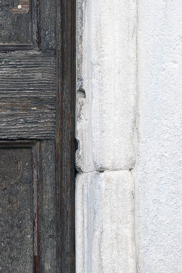 Photo 24795: Facade with worn, panelled, black double door