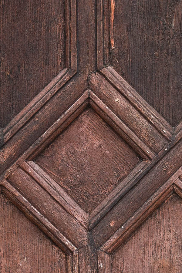 Photo 24843: Panelled, pink and unpainted, carved door