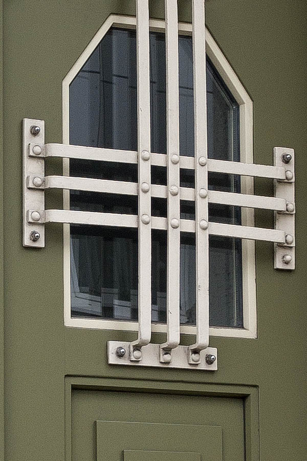 Photo 24930: Panelled, green double door with barred fan lights and a large door light
