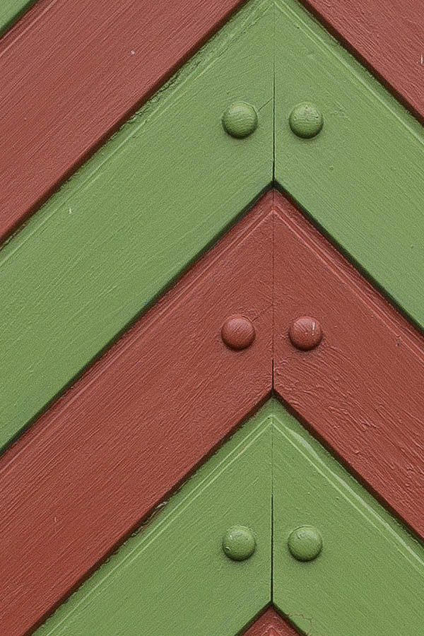 Photo 25078: Red and green door of diagonally mounted boards with nails